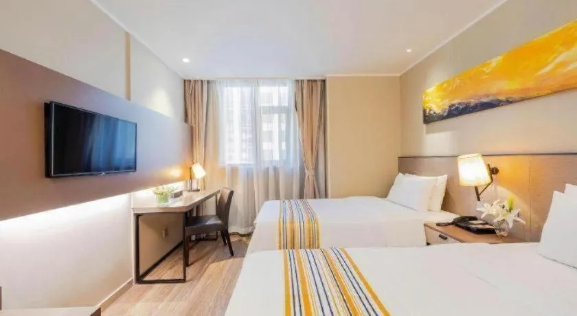 Bed in Home Inn Plus Shanghai Zhangjiang Guanglan Road Metro Station