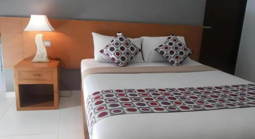 Bed in MANDARI HOTEL SINGARAJA