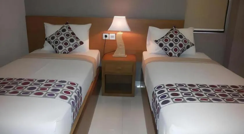 Bed in MANDARI HOTEL SINGARAJA
