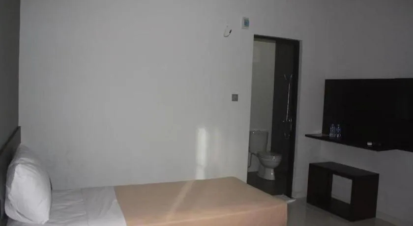 Bed in MANDARI HOTEL SINGARAJA