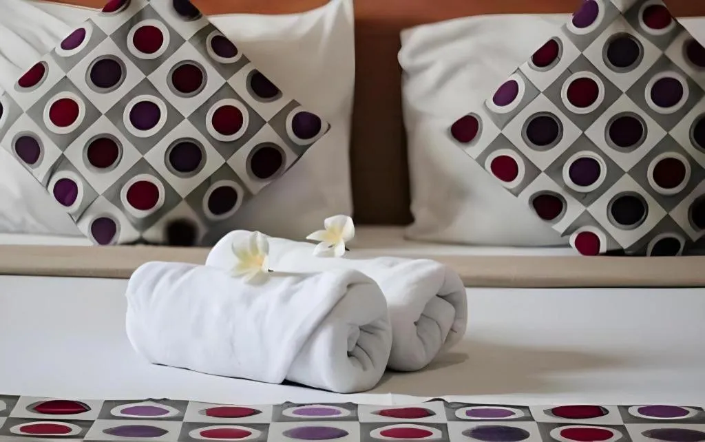 Bed in MANDARI HOTEL SINGARAJA