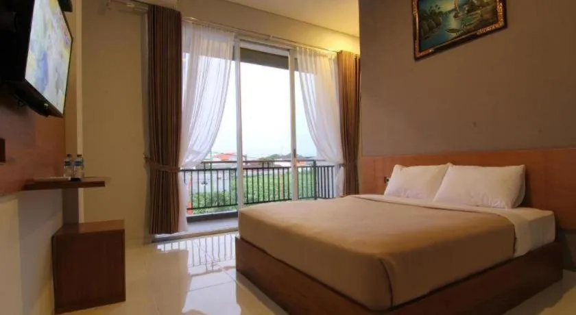 Bed in MANDARI HOTEL SINGARAJA