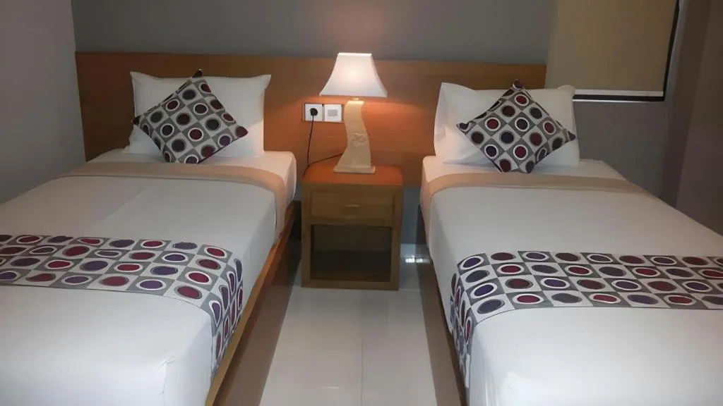 Bed in MANDARI HOTEL SINGARAJA
