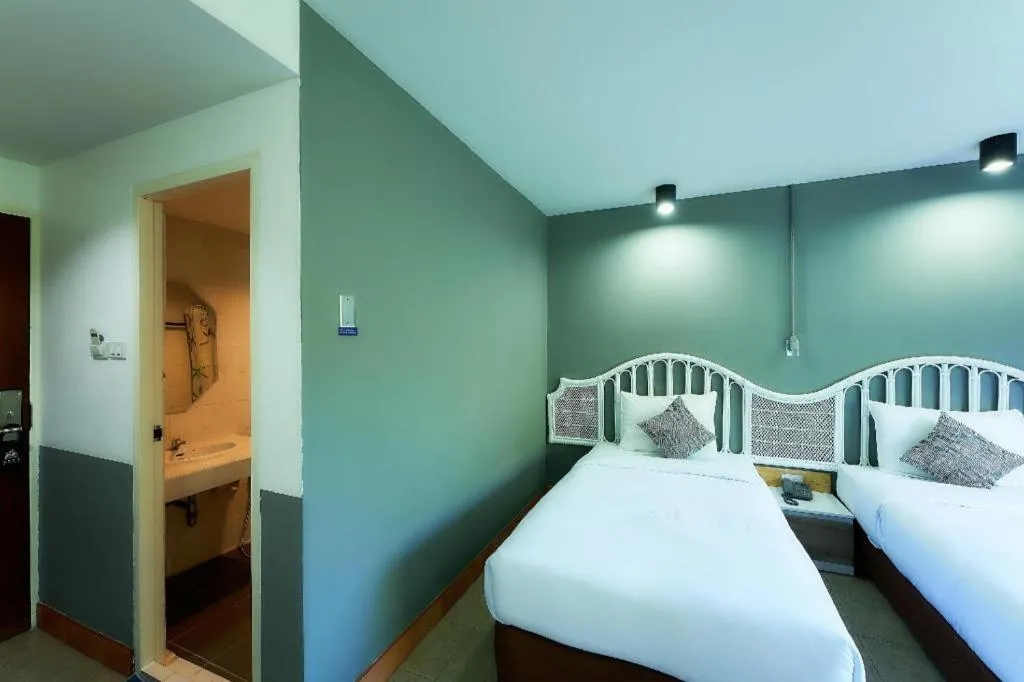 Bed in Nora Bukit Hotel