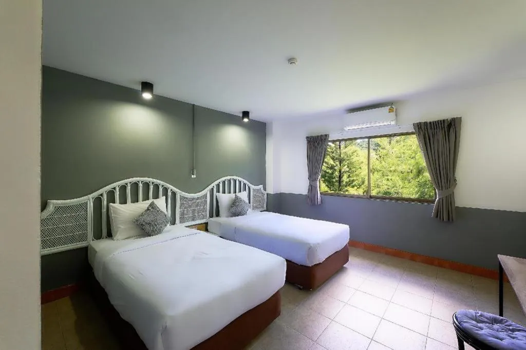 Bed in Nora Bukit Hotel