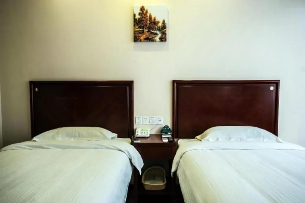 Bed in GreenTree Inn Qinhuangdao Peace Avenue Express Hotel