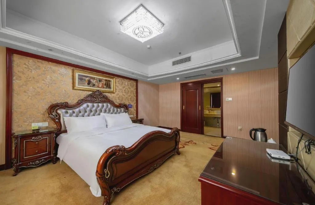 Bed in Vienna Hotel Yangzhou Outlets Plaza He Garden