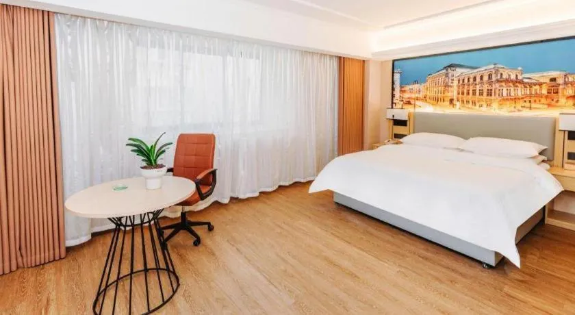 Bed in Vienna Hotel Yangzhou Outlets Plaza He Garden