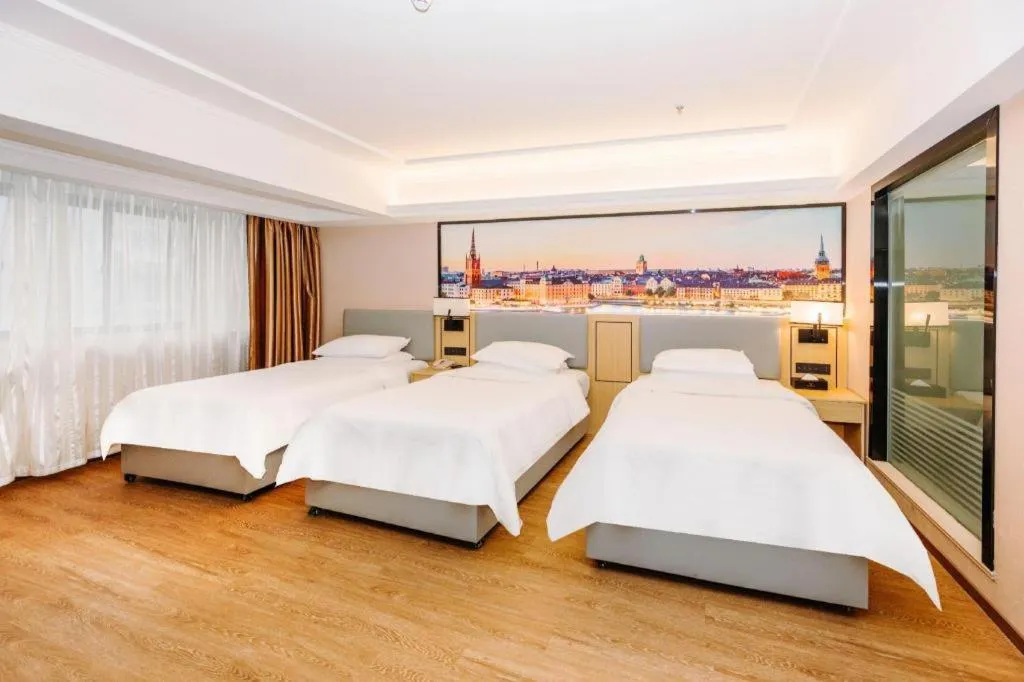 Bed in Vienna Hotel Yangzhou Outlets Plaza He Garden