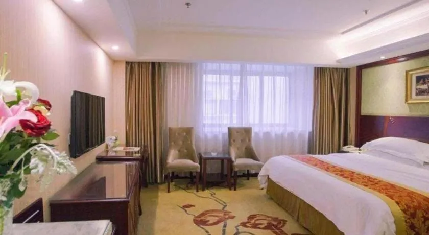 Bed in Vienna Hotel Yangzhou Outlets Plaza He Garden