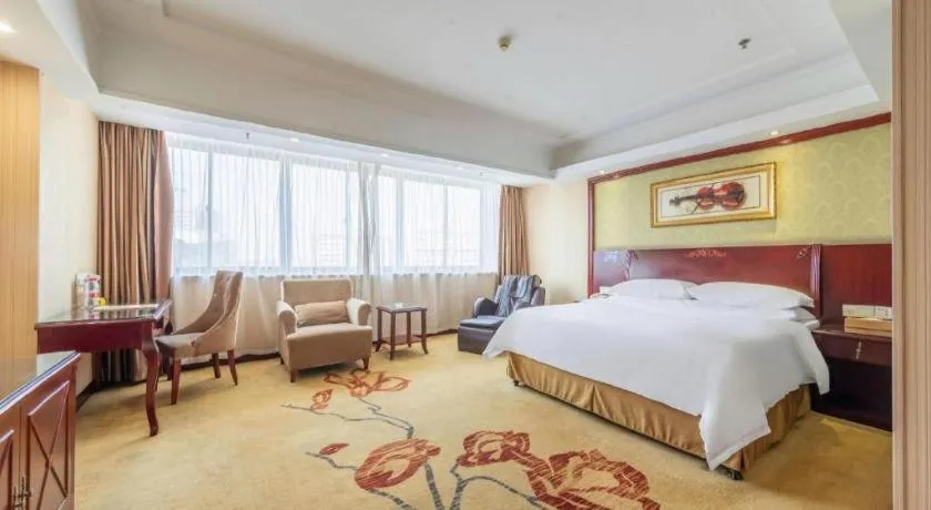 Bed in Vienna Hotel Yangzhou Outlets Plaza He Garden