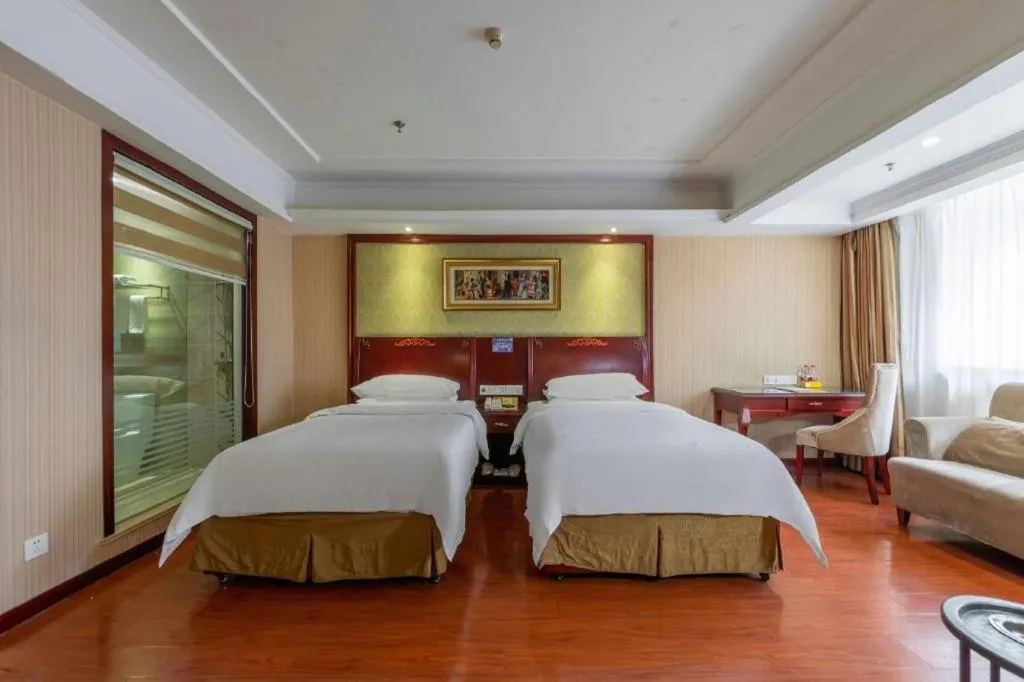 Bed in Vienna Hotel Yangzhou Outlets Plaza He Garden