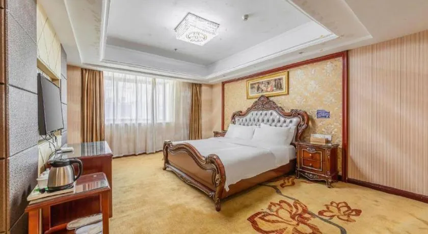 Bed in Vienna Hotel Yangzhou Outlets Plaza He Garden