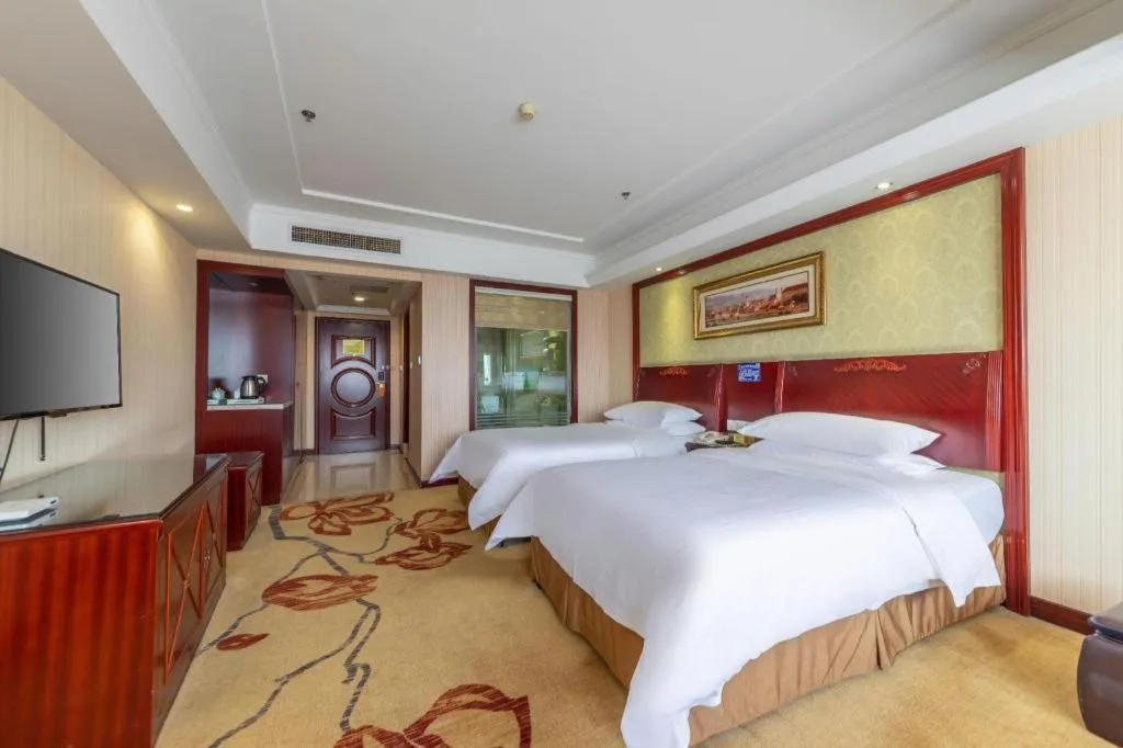 Bed in Vienna Hotel Yangzhou Outlets Plaza He Garden