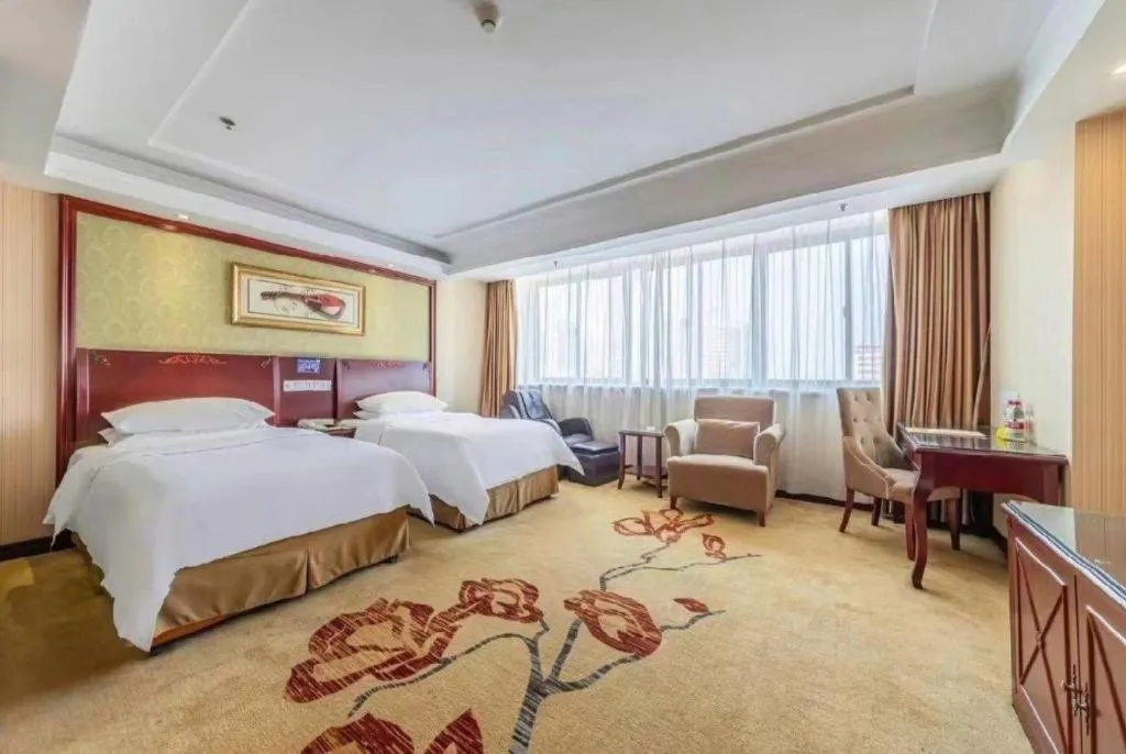 Bed in Vienna Hotel Yangzhou Outlets Plaza He Garden