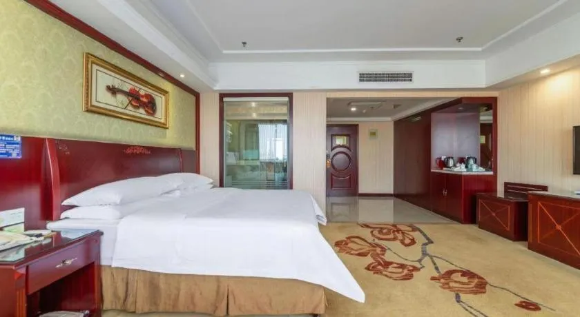 Bed in Vienna Hotel Yangzhou Outlets Plaza He Garden