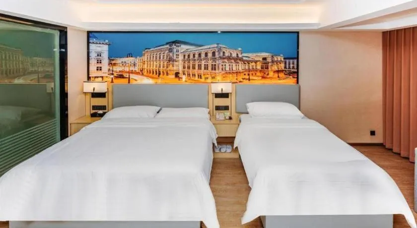 Bed in Vienna Hotel Yangzhou Outlets Plaza He Garden