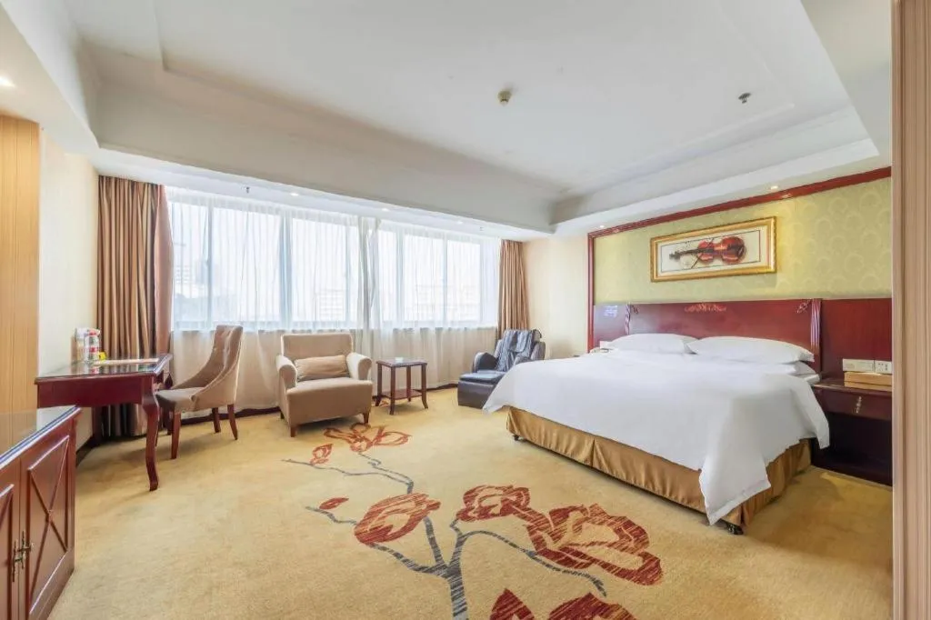Bed in Vienna Hotel Yangzhou Outlets Plaza He Garden