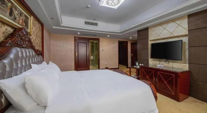 Bed in Vienna Hotel Yangzhou Outlets Plaza He Garden