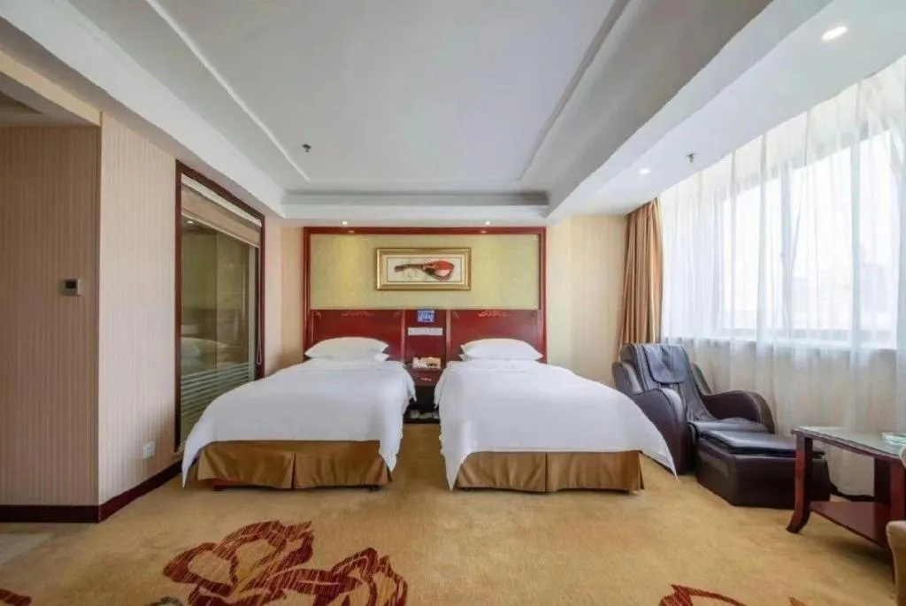 Bed in Vienna Hotel Yangzhou Outlets Plaza He Garden