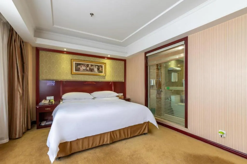 Bed in Vienna Hotel Yangzhou Outlets Plaza He Garden