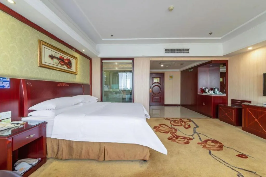 Bed in Vienna Hotel Yangzhou Outlets Plaza He Garden