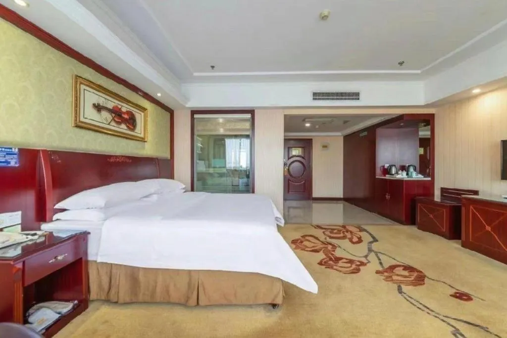 Bed in Vienna Hotel Yangzhou Outlets Plaza He Garden