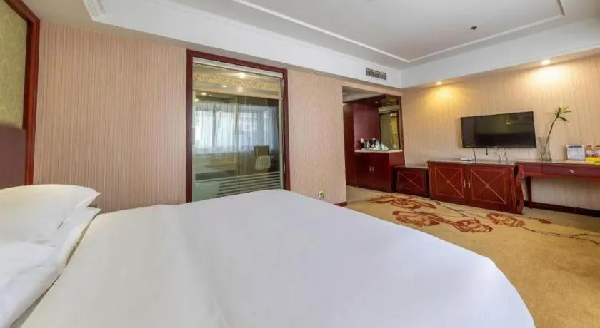 Bed in Vienna Hotel Yangzhou Outlets Plaza He Garden