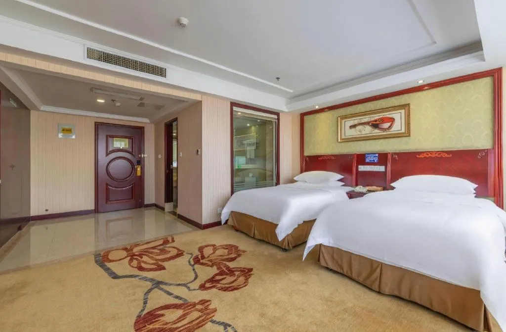 Bed in Vienna Hotel Yangzhou Outlets Plaza He Garden