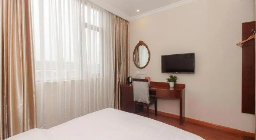 Bed in GreenTree Inn Wuxi Donggang Town Donghutang Shell Hotel