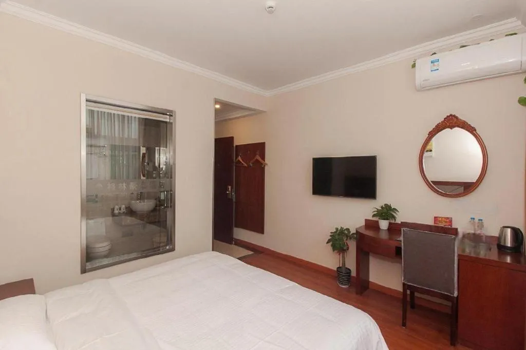 Bed in GreenTree Inn Wuxi Donggang Town Donghutang Shell Hotel