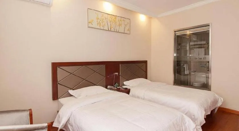 Bed in GreenTree Inn Wuxi Donggang Town Donghutang Shell Hotel