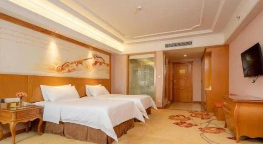 Bed in Vienna International Hotel Guangzhou Jichang Road Huangshi