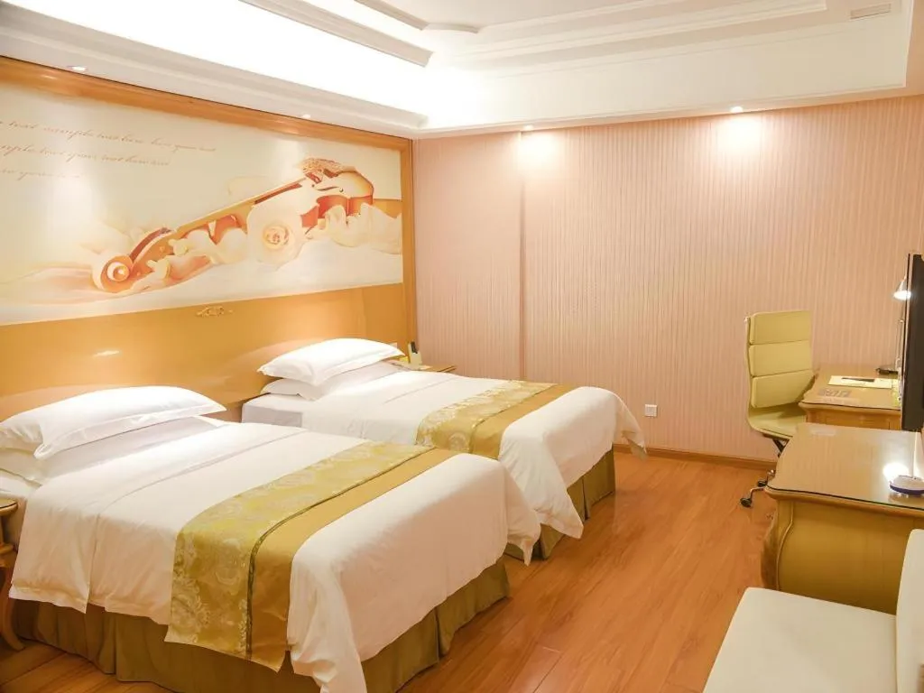 Bed in Vienna International Hotel Guangzhou Jichang Road Huangshi