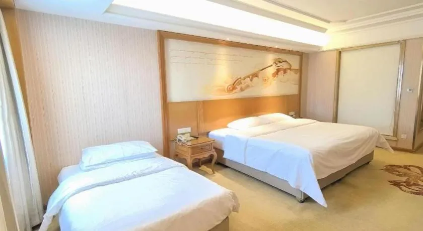 Bed in Vienna International Hotel Guangzhou Jichang Road Huangshi