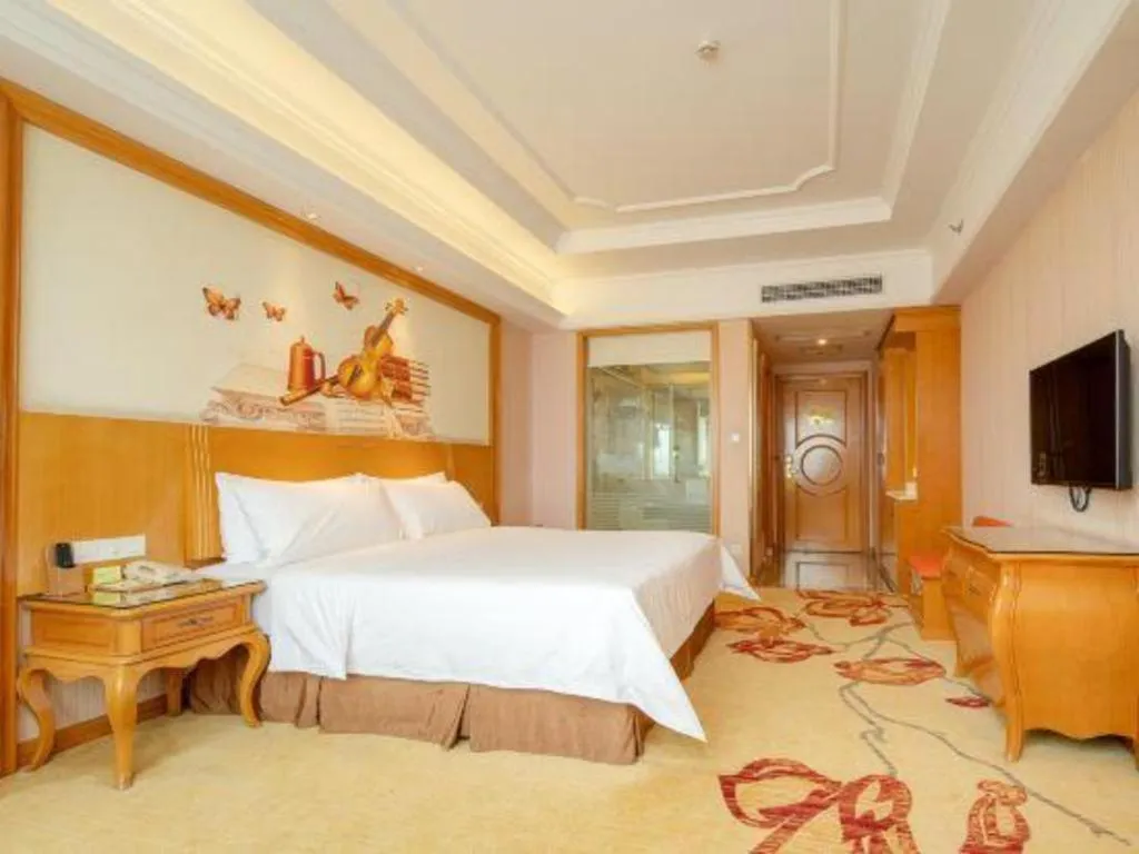 Bed in Vienna International Hotel Guangzhou Jichang Road Huangshi