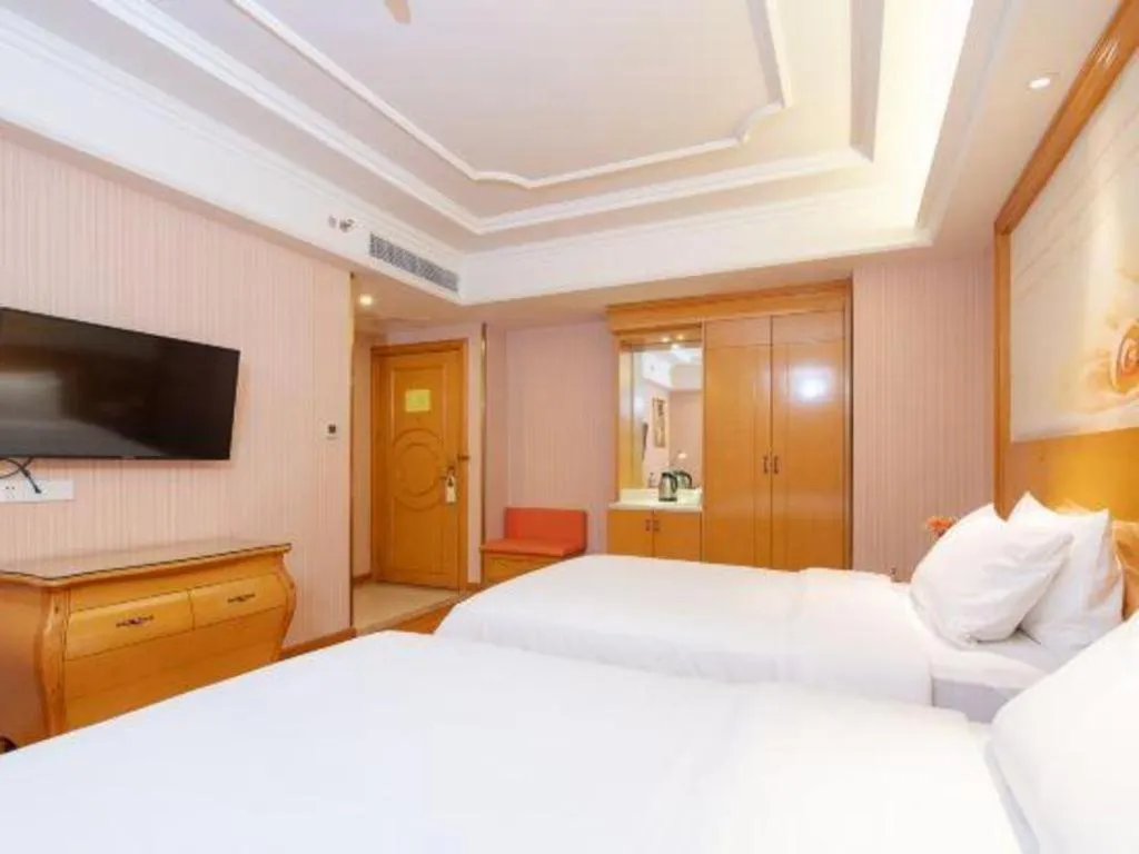 Bed in Vienna International Hotel Guangzhou Jichang Road Huangshi