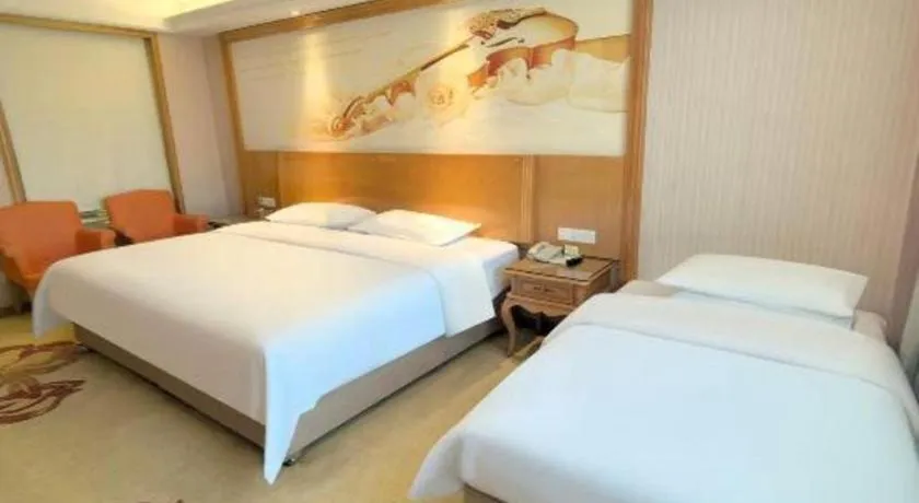 Bed in Vienna International Hotel Guangzhou Jichang Road Huangshi
