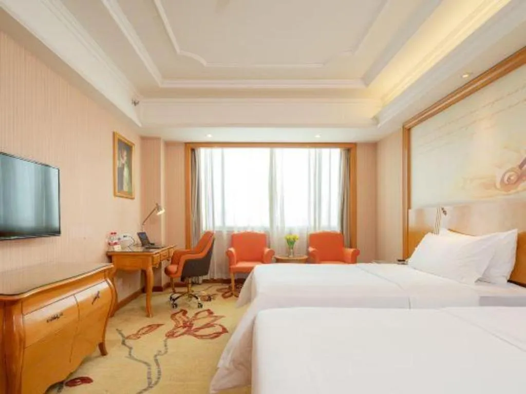 Bed in Vienna International Hotel Guangzhou Jichang Road Huangshi