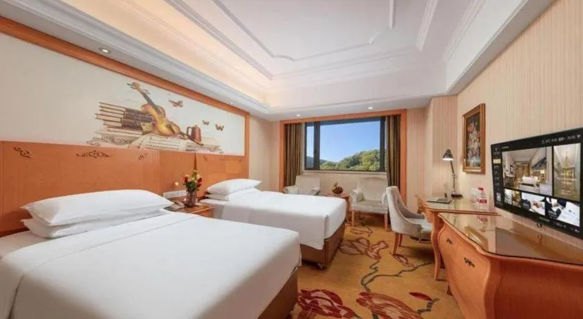 Bed in Vienna International Hotel Guangzhou Jichang Road Huangshi