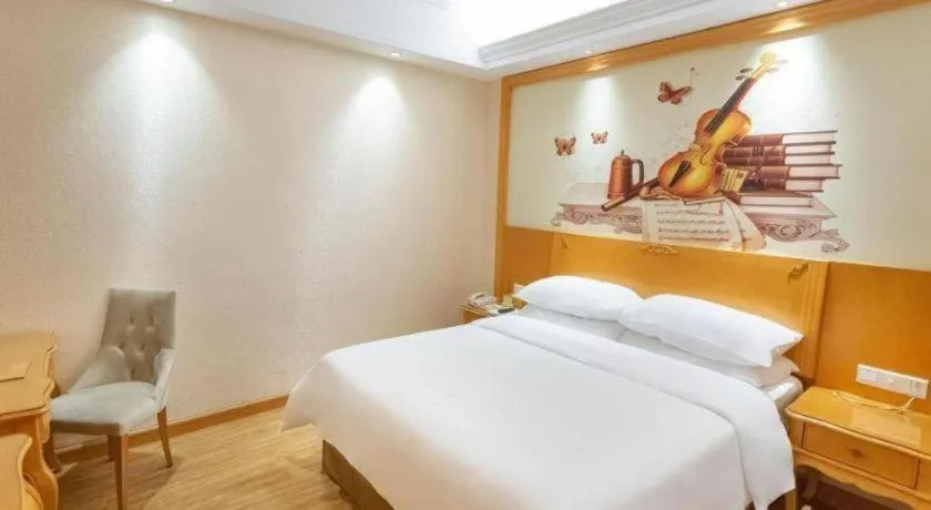 Bed in Vienna International Hotel Guangzhou Jichang Road Huangshi