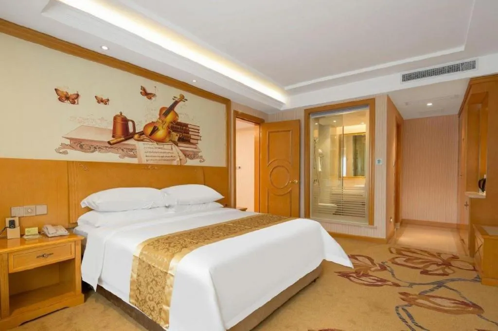 Bed in Vienna International Hotel Guangzhou Jichang Road Huangshi