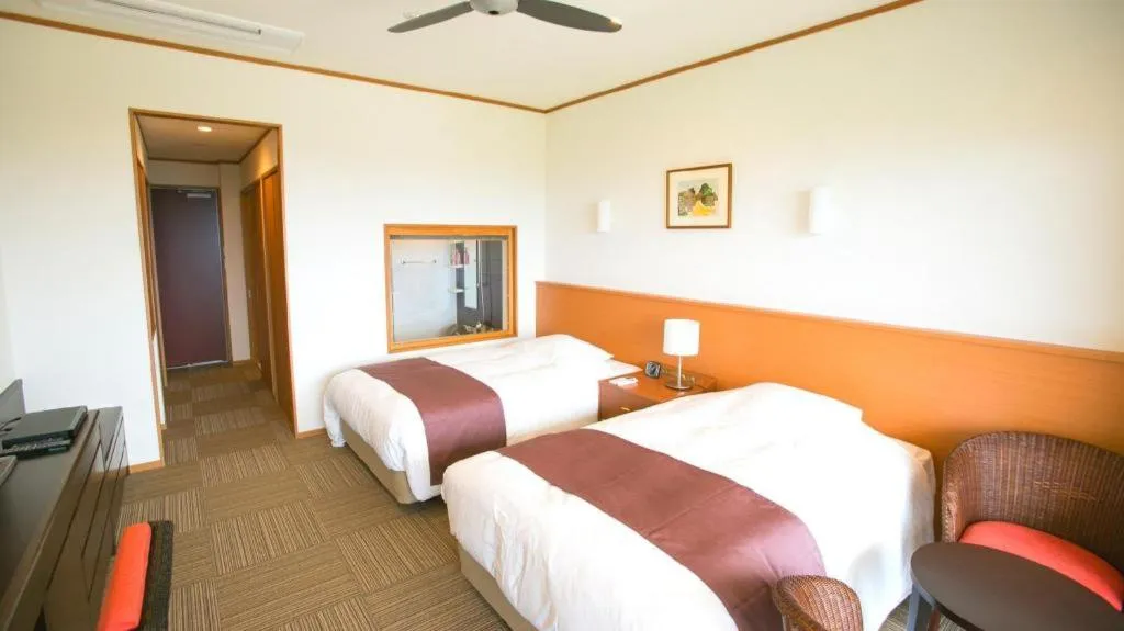 Bed in Sakura Resort Hotel Ishigaki