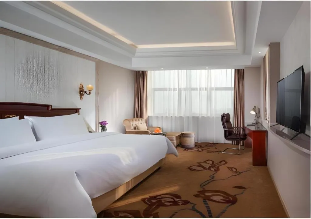 Bed in Vienna International Hotel Wuxi Taihu Expo Center