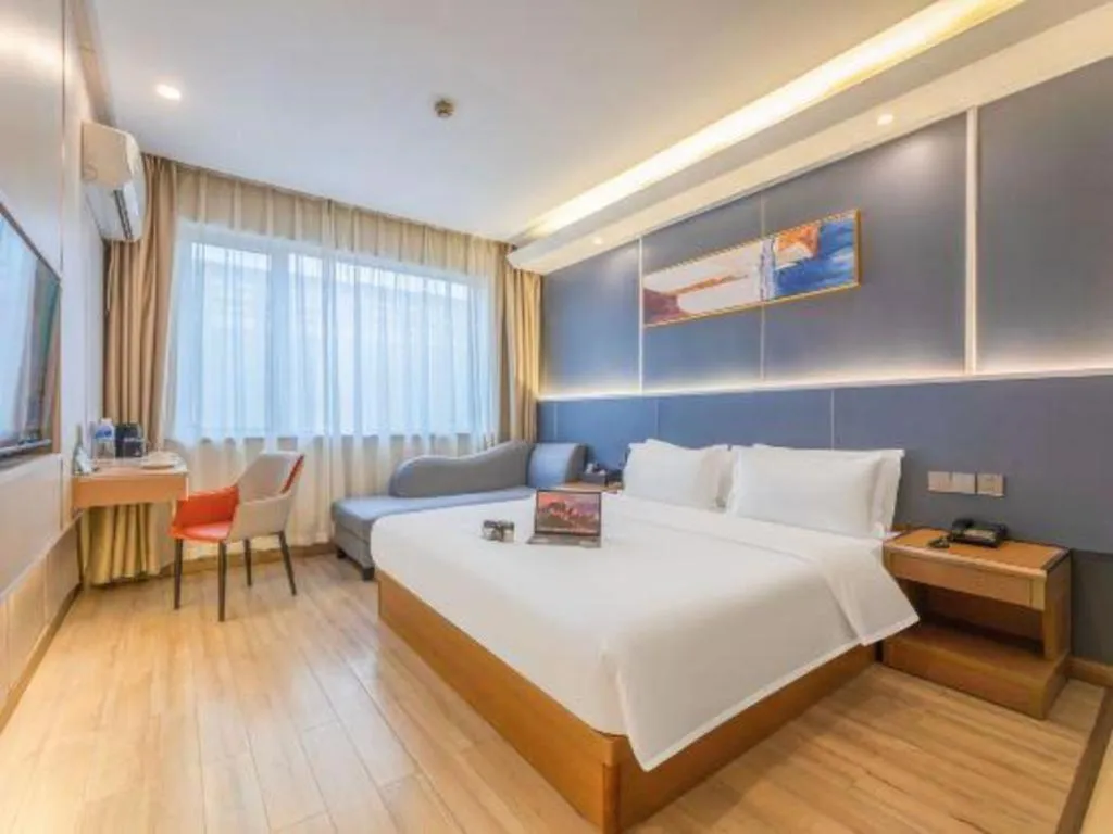 Bed in Vienna Hotel Shenzhen Pinghu Shuangyong Street Metro Station