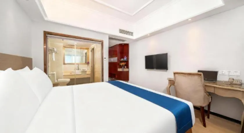 Bed in Vienna Hotel Shenzhen Pinghu Shuangyong Street Metro Station