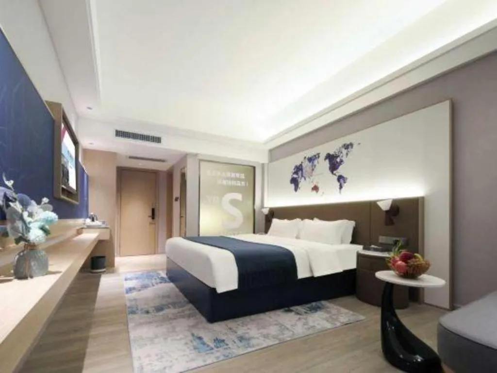 Bed in Vienna Hotel Shenzhen Pinghu Shuangyong Street Metro Station