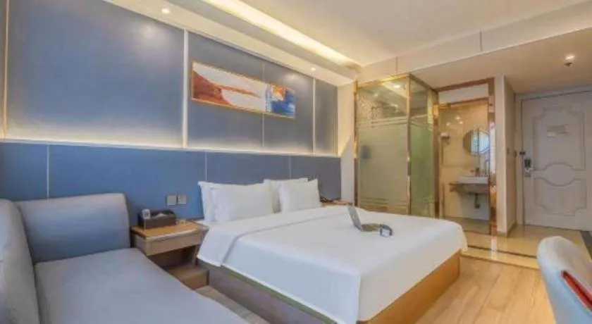 Bed in Vienna Hotel Shenzhen Pinghu Shuangyong Street Metro Station