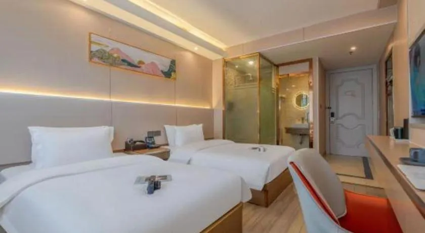 Bed in Vienna Hotel Shenzhen Pinghu Shuangyong Street Metro Station