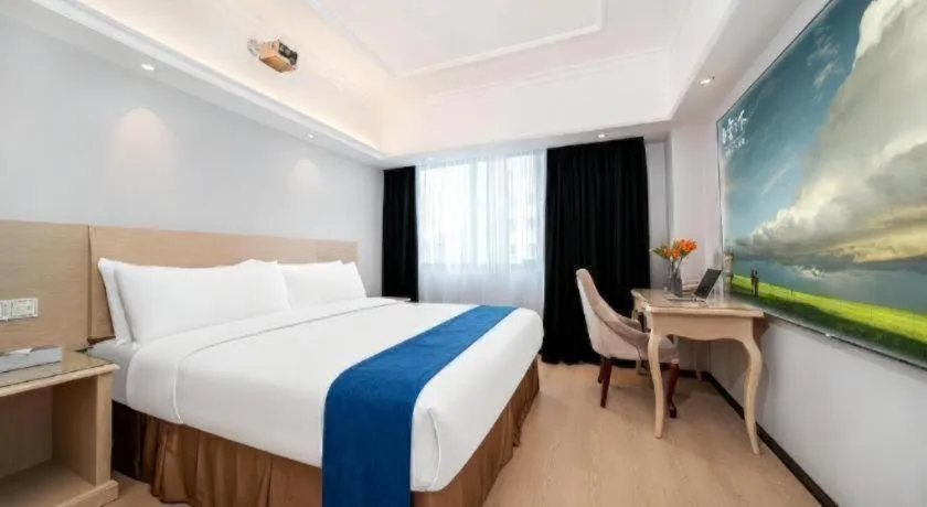 Bed in Vienna Hotel Shenzhen Pinghu Shuangyong Street Metro Station